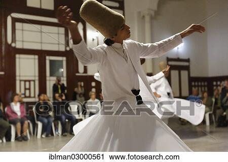 Stock Image - "Whirling Dervishes dancing the Sema, a Dervish dance, Sirkeci Railway Station, Istanbul, Turkey, Europe, Istanbul, Istanbul Province, Turkey, Asia". Fotosearch