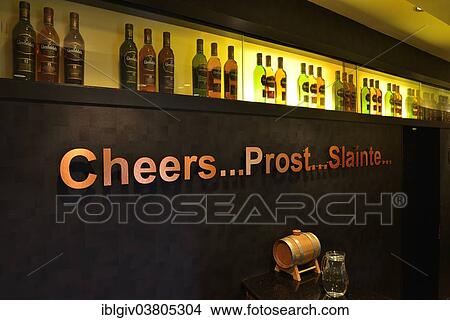 "Whiskey bottles and lettering """"cheers, prost and slainte"""" in the showroom of the Glenfiddich whisky distillery, Dufftown, Moray, Scottish Highlands, Scotland, United Kingdom, Europe" View Large Photo Image Picture - "Whiskey bottles and lettering """"cheers, prost and slainte"""" in the showroom of the Glenfiddich whisky distillery, Dufftown, Moray, Scottish Highlands, Scotland, United Kingdom, Europe". Fotosearch