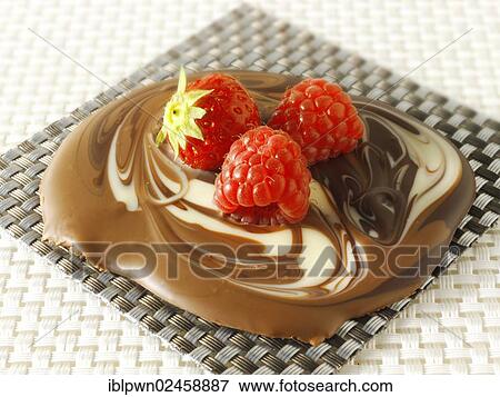 "White and milk chocolate swirls, decorated with strawberries and raspberries" View Large Photo Image Stock Photo - "White and milk chocolate swirls, decorated with strawberries and raspberries". Fotosearch