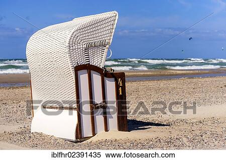 "White beach chair on the beach, Warnemuende, Mecklenburg-Western Pomerania, Germany, Europe" View Large Photo Image Stock Photography - "White beach chair on the beach, Warnemuende, Mecklenburg-Western Pomerania, Germany, Europe". Fotosearch