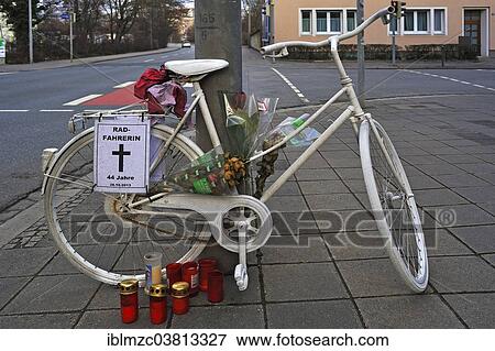 "White bicycle with candles, memorial site of a fatal accident, Nuremberg, Middle Franconia, Bavaria, Germany, Europe" View Large Photo Image Stock Photo - "White bicycle with candles, memorial site of a fatal accident, Nuremberg, Middle Franconia, Bavaria, Germany, Europe". Fotosearch