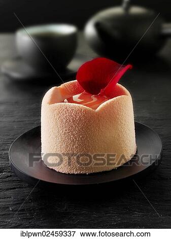 "White chocolate cake with a sponge case and strawberry filling, covered with pink white chocolate powder" View Large Photo Image Stock Photo - "White chocolate cake with a sponge case and strawberry filling, covered with pink white chocolate powder". Fotosearch