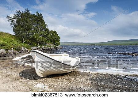 "White fishing boat on the shore of Loch Naver, County of Sutherland, Scotland, United Kingdom, Europe" View Large Photo Image Stock Image - "White fishing boat on the shore of Loch Naver, County of Sutherland, Scotland, United Kingdom, Europe". Fotosearch