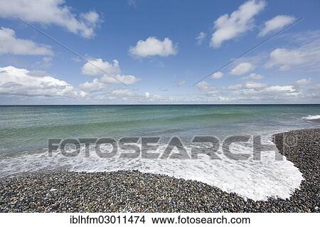 "White foam of a wave on a pebble beach, Dune island, Insel Helgoland, Helgoland, Schleswig-Holstein, Germany, Europe" View Large Photo Image Picture - "White foam of a wave on a pebble beach, Dune island, Insel Helgoland, Helgoland, Schleswig-Holstein, Germany, Europe". Fotosearch