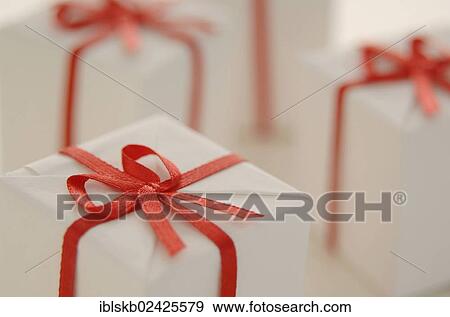 White gifts with red ribbon View Large Photo Image Stock Photo - White gifts with red ribbon. Fotosearch