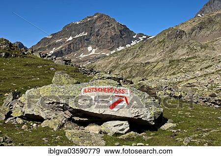 Stock Photo - "White-red-white markings of hiking trail and a signpost to Loetschen Pass, Lotschental, Canton of Valais, Switzerland, Europe". Fotosearch