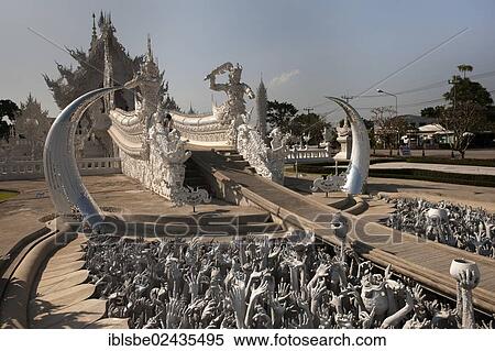 Stock Photography - "White Temple, entrance of Wat Rong Khun by Chalermchai Kositpipat, Chiang Rai, Northern Thailand, Thailand, Asia". Fotosearch