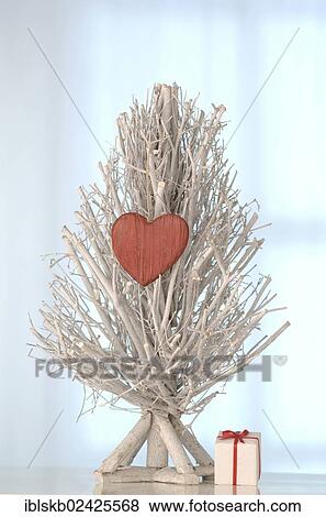 White tree made of twigs with a wooden heart and a gift View Large Photo Image Stock Photo - White tree made of twigs with a wooden heart and a gift. Fotosearch