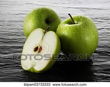 Whole and cut Granny Smith apples View Large Photo Image Stock Image - Whole and cut Granny Smith apples. Fotosearch