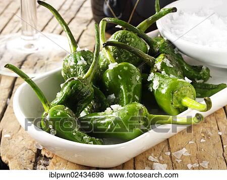 Whole griddled Padron peppers snack with sea salt View Large Photo Image Stock Photo - Whole griddled Padron peppers snack with sea salt. Fotosearch