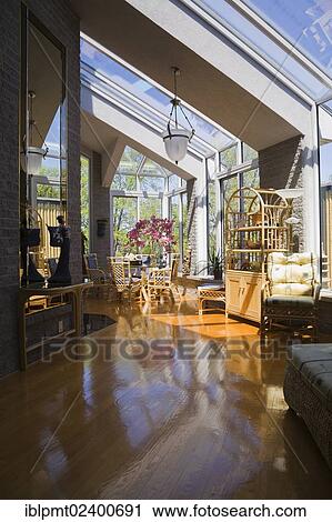 "Wicker furniture in an opened concept living room of a modern residential home, Quebec, Canada, North America" View Large Photo Image Stock Image - "Wicker furniture in an opened concept living room of a modern residential home, Quebec, Canada, North America". Fotosearch