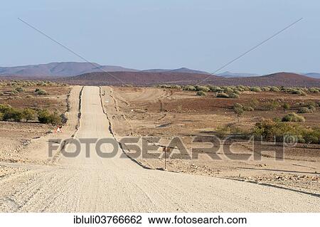 "Wide, straight gravel road in dry landscape, Kunene Region, Namibia, Africa" View Large Photo Image Stock Image - "Wide, straight gravel road in dry landscape, Kunene Region, Namibia, Africa". Fotosearch