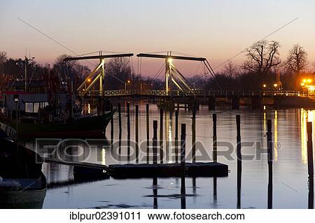 "Wiecker bascule bridge at dusk in the fishing port of Wieck, Greifswald, Mecklenburg-Western Pomerania, Germany, Europe" View Large Photo Image Stock Image - "Wiecker bascule bridge at dusk in the fishing port of Wieck, Greifswald, Mecklenburg-Western Pomerania, Germany, Europe". Fotosearch