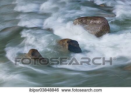 Stock Photograph - "Wild water lapping against granite stones, Sellrain, Tyrol, Austria, Europe". Fotosearch