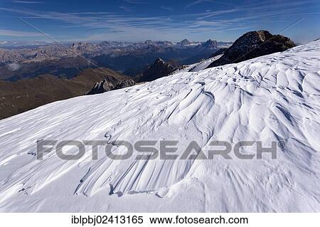 Wind blown snow formations, Marmolada Mountain, Dolomites, Italy, Europe View Large Photo Image Stock Photography - Wind blown snow formations, Marmolada Mountain, Dolomites, Italy, Europe. Fotosearch
