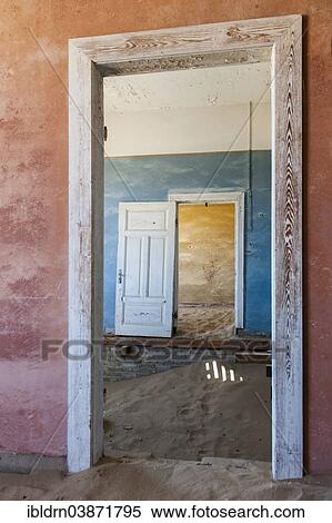 "Wind-borne sand in a house of the former diamond miners settlement that is slowly covered by the sand of the Namib Desert, Kolmanskop, ÇKaras, Namibia, Africa" View Large Photo Image Stock Photography - "Wind-borne sand in a house of the former diamond miners settlement that is slowly covered by the sand of the Namib Desert, Kolmanskop, ÇKaras, Namibia, Africa". Fotosearch