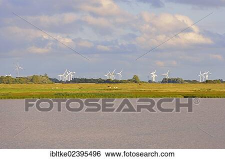 "Wind farm near Toenning with the Eider river, Schleswig-Holstein, Germany, Europe" View Large Photo Image Stock Photograph - "Wind farm near Toenning with the Eider river, Schleswig-Holstein, Germany, Europe". Fotosearch