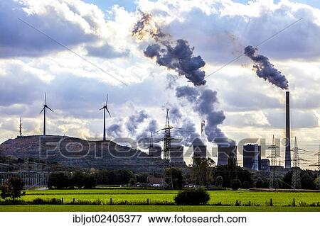Stock Photo - "Wind turbine on the Halde Scholven heap next to the E. ON coal-fired power plant Scholven, power lines, Gelsenkirchen, North Rhine-Westphalia, Germany, Europe". Fotosearch