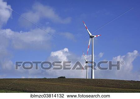 Stock Image - "Wind turbines against blue sky, Rhena, Mecklenburg-Vorpommern, Germany, Europe". Fotosearch