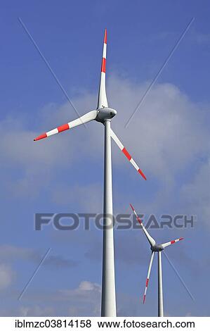 Stock Photo - "Wind turbines against blue sky, Rhena, Mecklenburg-Vorpommern, Germany, Europe". Fotosearch