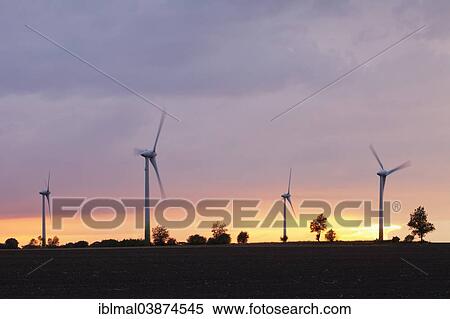 "Wind turbines at sunset, island of Fehmarn, Schleswig-Holstein, Germany, Europe" View Large Photo Image Stock Photography - "Wind turbines at sunset, island of Fehmarn, Schleswig-Holstein, Germany, Europe". Fotosearch