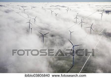 "Wind turbines covered by low clouds, blue sky, aerial view, Marsberg, Sauerland region, North Rhine-Westphalia, Germany, Europe" View Large Photo Image Stock Image - "Wind turbines covered by low clouds, blue sky, aerial view, Marsberg, Sauerland region, North Rhine-Westphalia, Germany, Europe". Fotosearch