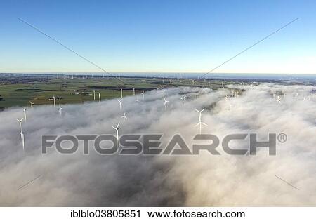 "Wind turbines covered by low clouds, blue sky, aerial view, Marsberg, Sauerland region, North Rhine-Westphalia, Germany, Europe" View Large Photo Image Stock Image - "Wind turbines covered by low clouds, blue sky, aerial view, Marsberg, Sauerland region, North Rhine-Westphalia, Germany, Europe". Fotosearch