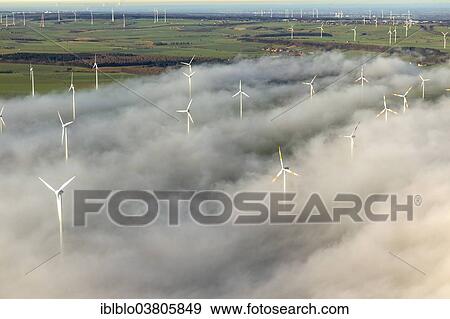 "Wind turbines covered by low clouds, blue sky, aerial view, Marsberg, Sauerland region, North Rhine-Westphalia, Germany, Europe" View Large Photo Image Stock Photo - "Wind turbines covered by low clouds, blue sky, aerial view, Marsberg, Sauerland region, North Rhine-Westphalia, Germany, Europe". Fotosearch