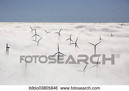"Wind turbines covered by low clouds, blue sky, aerial view, Marsberg, Sauerland region, North Rhine-Westphalia, Germany, Europe" View Large Photo Image Stock Photograph - "Wind turbines covered by low clouds, blue sky, aerial view, Marsberg, Sauerland region, North Rhine-Westphalia, Germany, Europe". Fotosearch