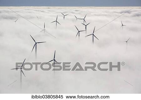 "Wind turbines covered by low clouds, blue sky, aerial view, Marsberg, Sauerland region, North Rhine-Westphalia, Germany, Europe" View Large Photo Image Stock Photography - "Wind turbines covered by low clouds, blue sky, aerial view, Marsberg, Sauerland region, North Rhine-Westphalia, Germany, Europe". Fotosearch