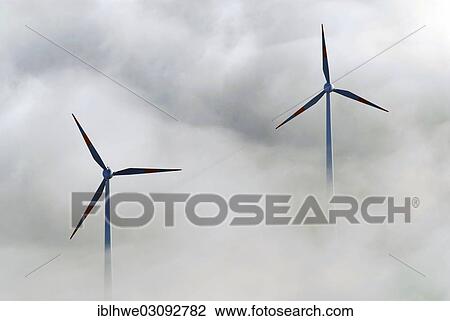 Stock Image - "Wind turbines in the fog, Gelande der Shell Raffinerie Hamburg-Harburg, Hamburg, Hamburg, Germany, Europe". Fotosearch