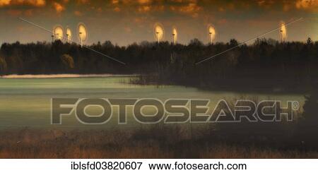 "Wind turbines rotating on the edge of a former lignite mine, Lubbenau, Brandenburg, Germany, Europe" View Large Photo Image Stock Photo - "Wind turbines rotating on the edge of a former lignite mine, Lubbenau, Brandenburg, Germany, Europe". Fotosearch