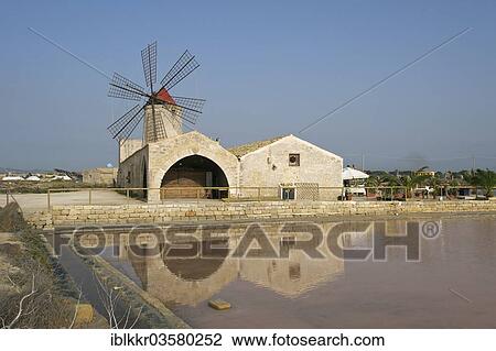 Stock Image - "Windmill in a saline, Trapani, Province of Trapani, Sicily, Italy, Europe". Fotosearch