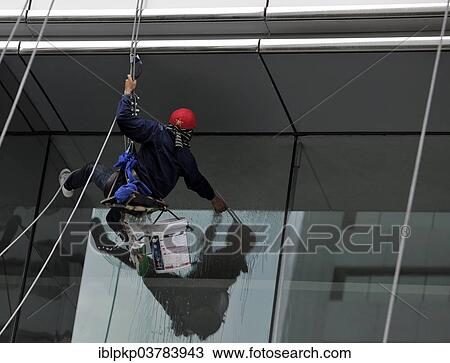 Window cleaner cleaning a window pane View Large Photo Image Stock Image - Window cleaner cleaning a window pane. Fotosearch