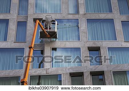 Stock Photo - "Window cleaner cleaning the windows of a hotel, Berlin, Germany, Europe". Fotosearch
