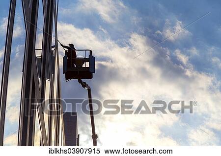 "Window cleaner cleaning the windows of a hotel, Berlin, Germany, Europe" View Large Photo Image Stock Photography - "Window cleaner cleaning the windows of a hotel, Berlin, Germany, Europe". Fotosearch
