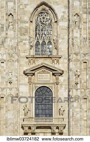 Stock Image - "Window over the main portal of the west facade of Milan Cathedral or Duomo di Santa Maria Nascente, Milan, Lombardy, Italy, Europe". Fotosearch