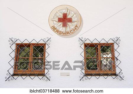 "Windows and the logo of the Bergwacht Mountain Rescue Service, Mittenwald, Werdenfelser Land, Upper Bavaria, Bavaria, Germany, Europe" View Large Photo Image Stock Photo - "Windows and the logo of the Bergwacht Mountain Rescue Service, Mittenwald, Werdenfelser Land, Upper Bavaria, Bavaria, Germany, Europe". Fotosearch