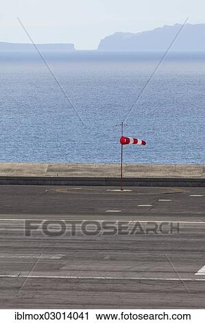 "Windsock at Madeira Airport, LPMA, also known as Funchal Airport and Santa Catarina Airport, Agua de Pena, Funchal, Madeira, Portugal, Europe" View Large Photo Image Stock Image - "Windsock at Madeira Airport, LPMA, also known as Funchal Airport and Santa Catarina Airport, Agua de Pena, Funchal, Madeira, Portugal, Europe". Fotosearch