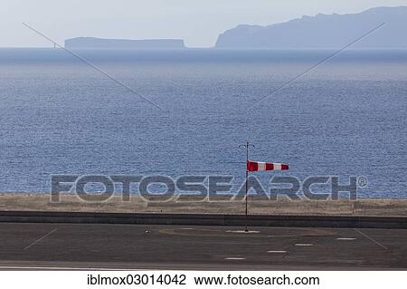 "Windsock at Madeira Airport, LPMA, also known as Funchal Airport or Santa Catarina Airport, Agua de Pena, Funchal, Madeira, Portugal, Europe" View Large Photo Image Stock Image - "Windsock at Madeira Airport, LPMA, also known as Funchal Airport or Santa Catarina Airport, Agua de Pena, Funchal, Madeira, Portugal, Europe". Fotosearch