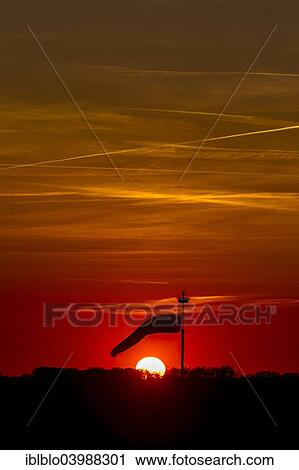 Stock Image - "Windsock in the sunset at Muritz Airpark, former military airport Rechlin-Larz, Larz, Mecklenburg-Western Pomerania, Germany, Europe". Fotosearch