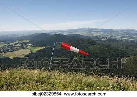 Picture - "Windsock, view from Puy de Dome onto the Massif of Sancy, Auvergne, France, Europe". Fotosearch