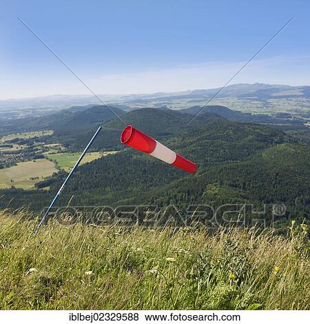 Stock Photo - "Windsock, view from Puy de Dome onto the Massif of Sancy, Auvergne, France, Europe". Fotosearch