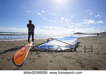 Stock Image - "Windsurfers and kiteboarders on the beach in Playa del Medano, Tenerife, Canary Islands, Spain, Europe". Fotosearch