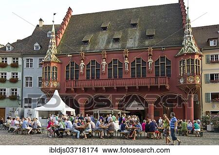 "Wine stand and restaurants in front of the Historical Merchants Hall on Muensterplatz square or Cathedral Square, Freiburg im Breisgau, Baden-Wurttemberg, Germany, Europe" View Large Photo Image Picture - "Wine stand and restaurants in front of the Historical Merchants Hall on Muensterplatz square or Cathedral Square, Freiburg im Breisgau, Baden-Wurttemberg, Germany, Europe". Fotosearch
