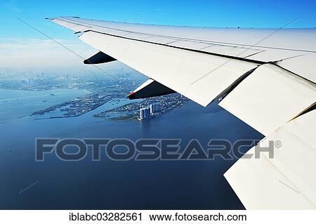 "Wing of a plane and views of the port area of ​​Jakarta on landing approach, near Jakarta, Java, Indonesia, Asia" View Large Photo Image Stock Image - "Wing of a plane and views of the port area of ​​Jakarta on landing approach, near Jakarta, Java, Indonesia, Asia". Fotosearch