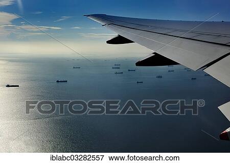 "Wing of a plane with views of the port area of ​​Jakarta on landing approach, near Jakarta, Java, Indonesia, Asia" View Large Photo Image Stock Photo - "Wing of a plane with views of the port area of ​​Jakarta on landing approach, near Jakarta, Java, Indonesia, Asia". Fotosearch