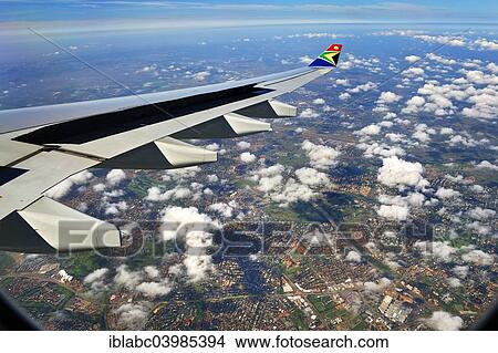 "Wing of an Airbus in flight, with winglet and the logo of SAA, South African Airways, suburbs of Johannesburg at the back, South Africa, Africa" View Large Photo Image Picture - "Wing of an Airbus in flight, with winglet and the logo of SAA, South African Airways, suburbs of Johannesburg at the back, South Africa, Africa". Fotosearch