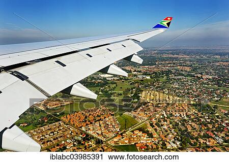 "Wing of an Airbus in flight, with winglet and the logo of SAA, South African Airways, suburbs of Johannesburg at the back, South Africa, Africa" View Large Photo Image Stock Image - "Wing of an Airbus in flight, with winglet and the logo of SAA, South African Airways, suburbs of Johannesburg at the back, South Africa, Africa". Fotosearch