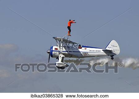 "Wing walker on airplane, Waukesha Air Show, Waukesha, Wisconsin, USA" View Large Photo Image Stock Photo - "Wing walker on airplane, Waukesha Air Show, Waukesha, Wisconsin, USA". Fotosearch
